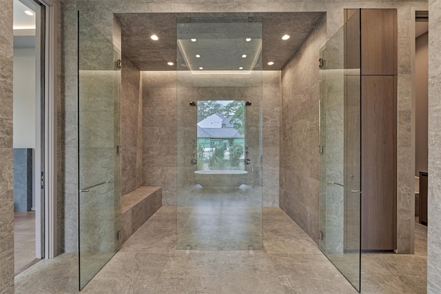 bathroom featuring tile walls