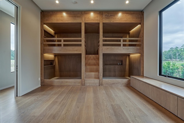 unfurnished bedroom with light wood-type flooring