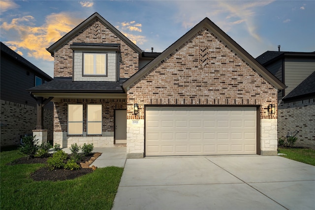 view of front of house featuring a shingled roof, an attached garage, concrete driveway, and brick siding