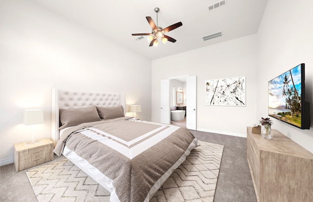 carpeted bedroom with high vaulted ceiling, ceiling fan, and ensuite bathroom