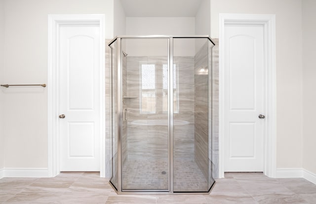 bathroom featuring walk in shower