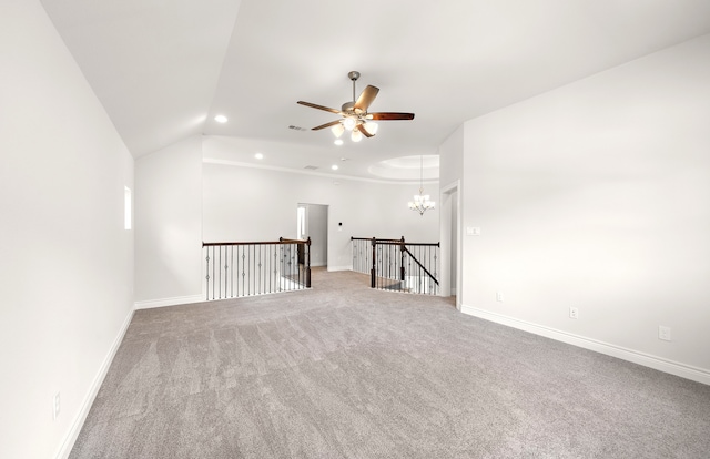 carpeted spare room with lofted ceiling and ceiling fan with notable chandelier