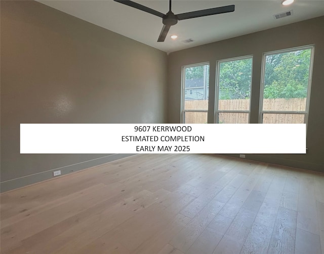 spare room with wood finished floors, visible vents, recessed lighting, and ceiling fan