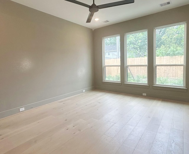 9607 Kerrwood Ln, Houston, TX 77080 - spare room featuring light wood-style flooring, a ceiling fan, and baseboards