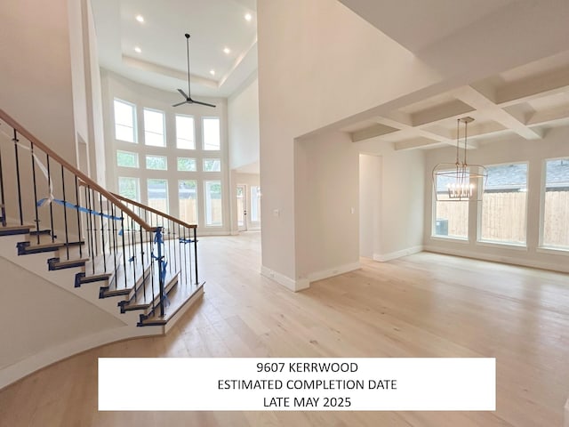 9607 Kerrwood Ln, Houston, TX 77080 - stairway featuring wood finished floors, plenty of natural light, a chandelier, recessed lighting, and baseboards