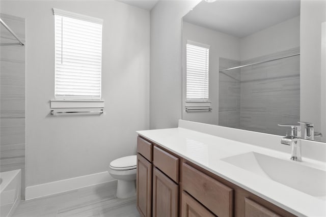 bathroom featuring tile patterned flooring, vanity, and toilet