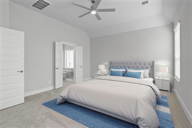 bedroom featuring ensuite bath, ceiling fan, carpet, and vaulted ceiling