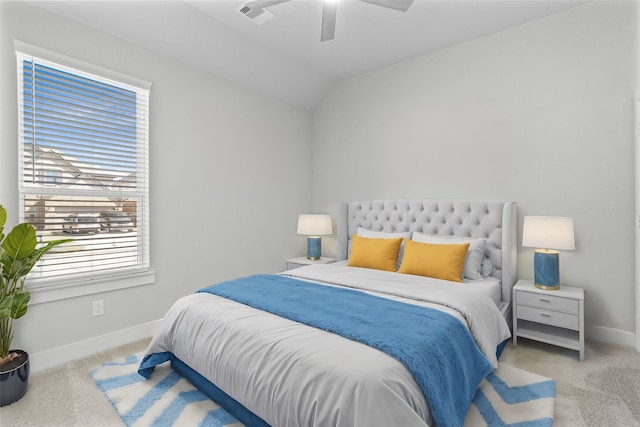 carpeted bedroom featuring ceiling fan and lofted ceiling