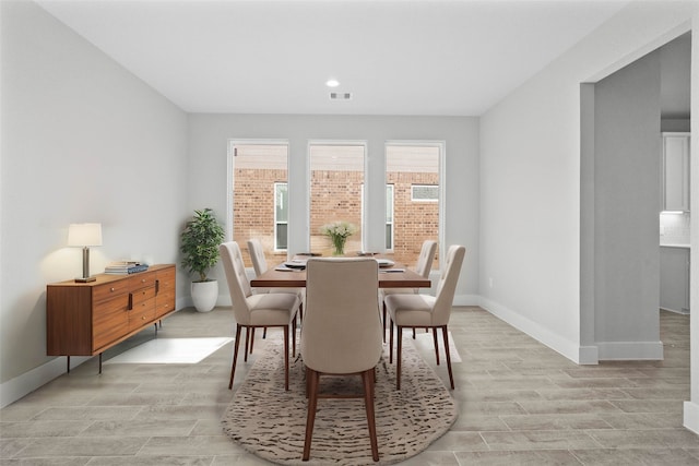 dining area featuring light wood-type flooring