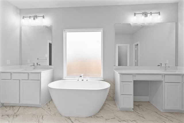 bathroom with a bath and vanity