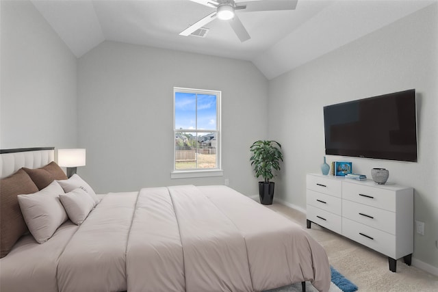 carpeted bedroom featuring lofted ceiling and ceiling fan