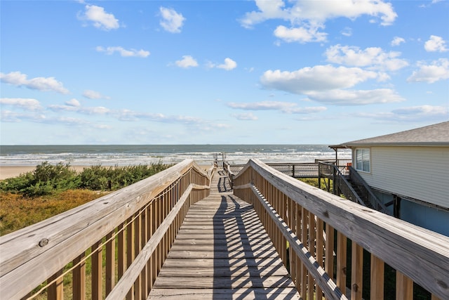 view of home's community featuring a view of the beach and a water view