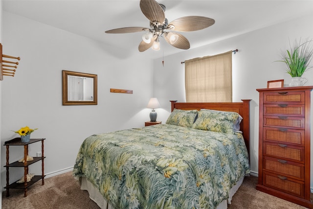 bedroom featuring ceiling fan and carpet