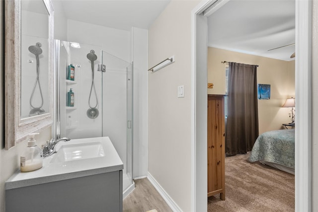 211 Ocean Dr, Surfside Beach, TX 77541 - full bathroom featuring a stall shower, connected bathroom, and vanity