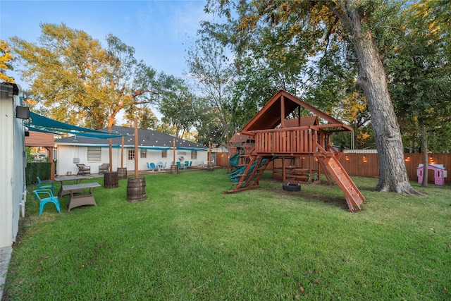 view of playground with a yard