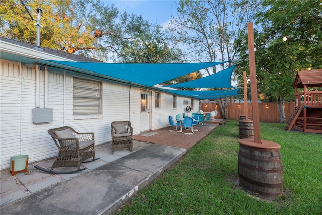 view of patio / terrace with a playground and a wooden deck