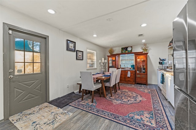 dining area with dark wood-type flooring