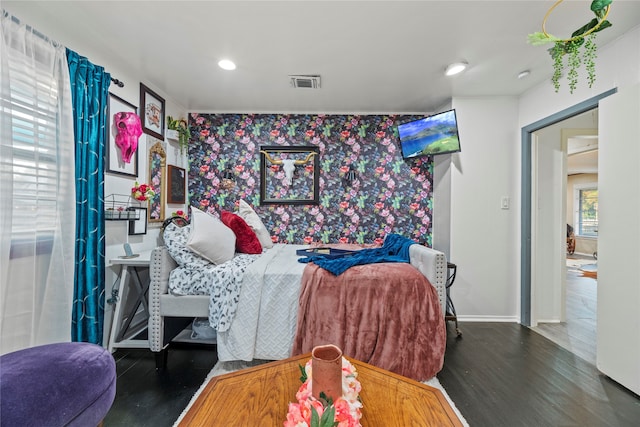 bedroom with dark wood-type flooring