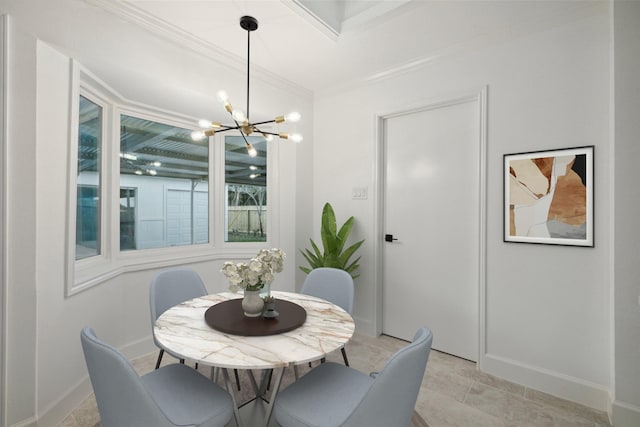 dining space featuring an inviting chandelier and ornamental molding