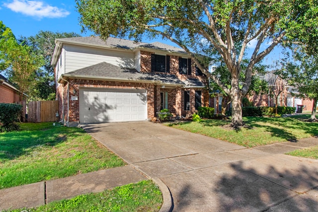 view of front of property with a garage and a front lawn