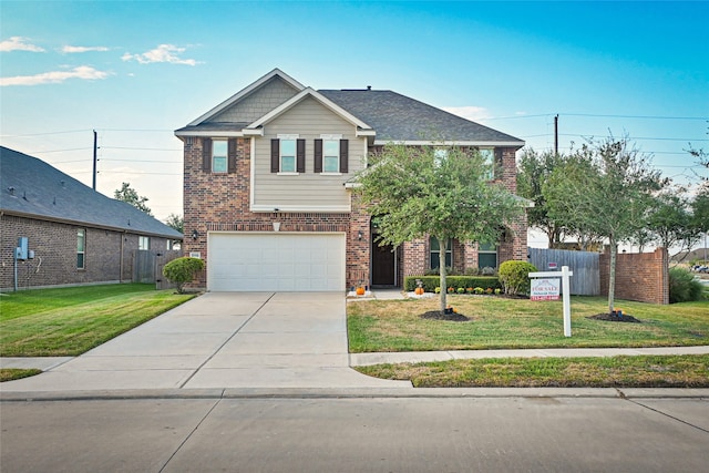 view of front of property featuring a garage and a front yard