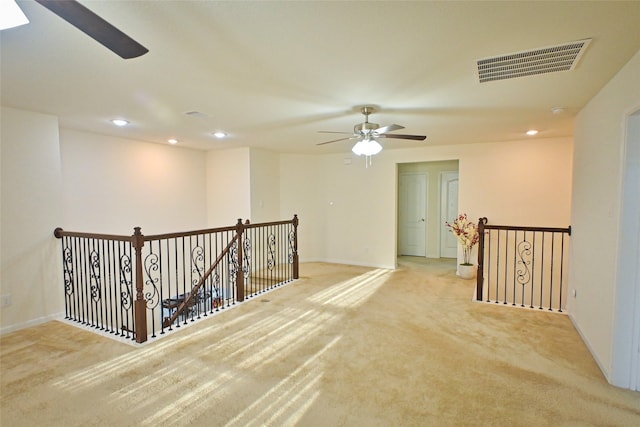 hallway with light carpet