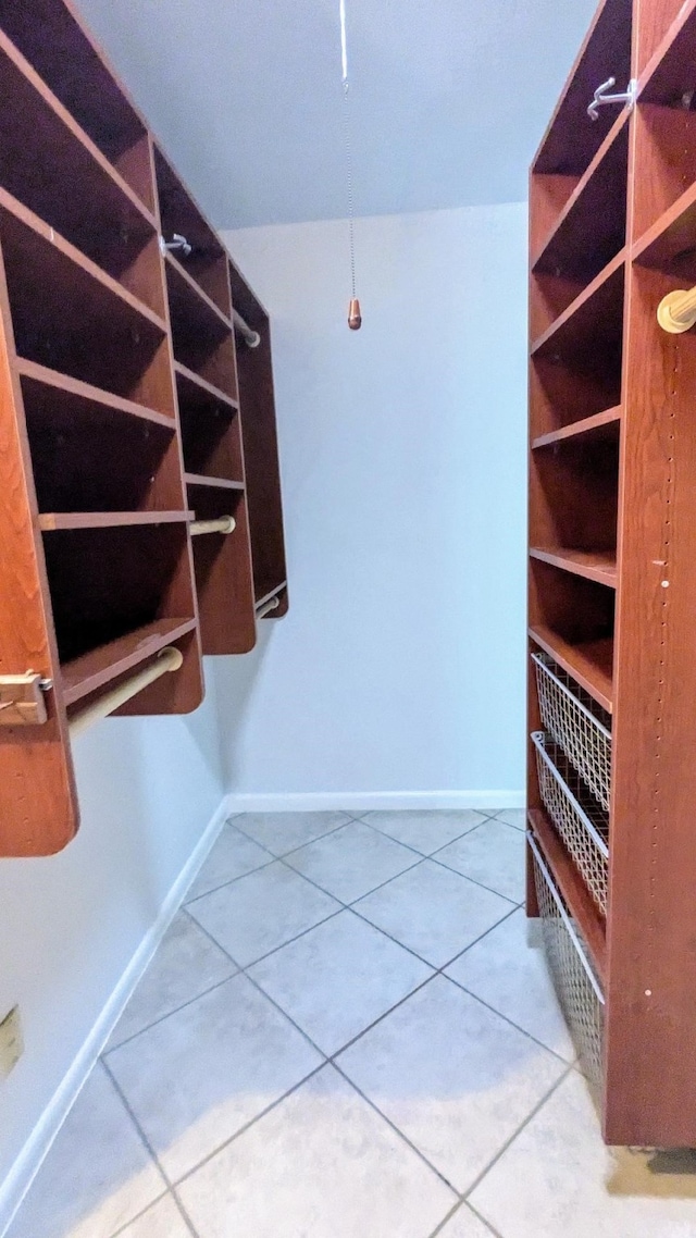 spacious closet featuring tile patterned floors