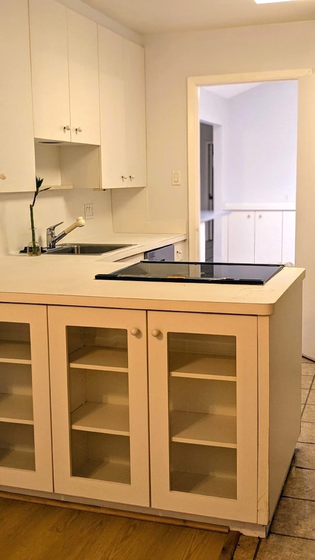 kitchen featuring white cabinets and wood-type flooring