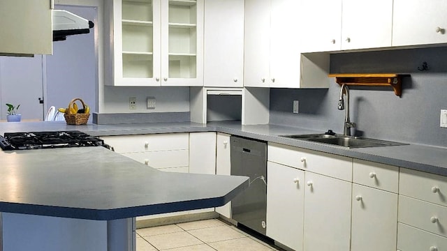 kitchen featuring white cabinets, light tile patterned floors, sink, and dishwasher