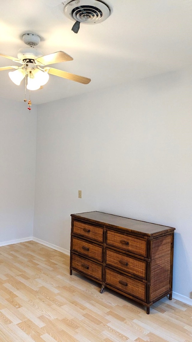 interior space with light hardwood / wood-style floors and ceiling fan