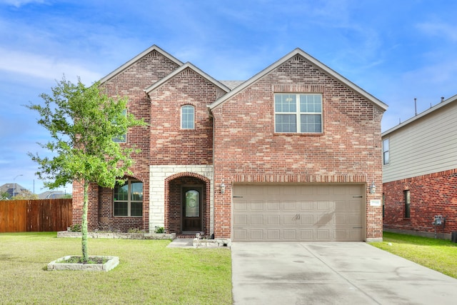 view of front property featuring a garage and a front lawn