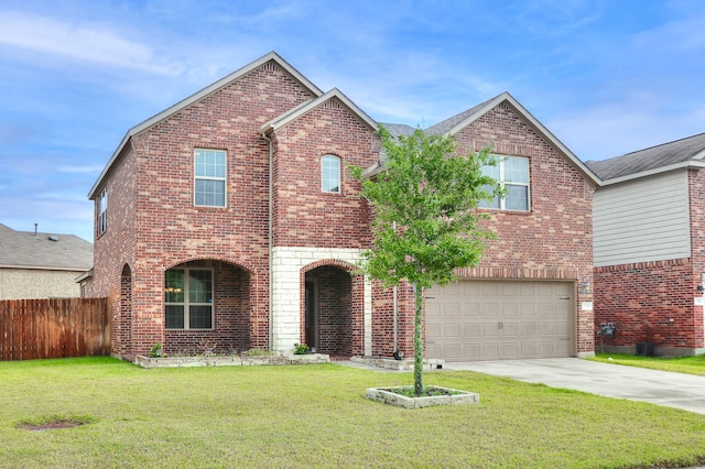 front of property featuring a garage and a front yard