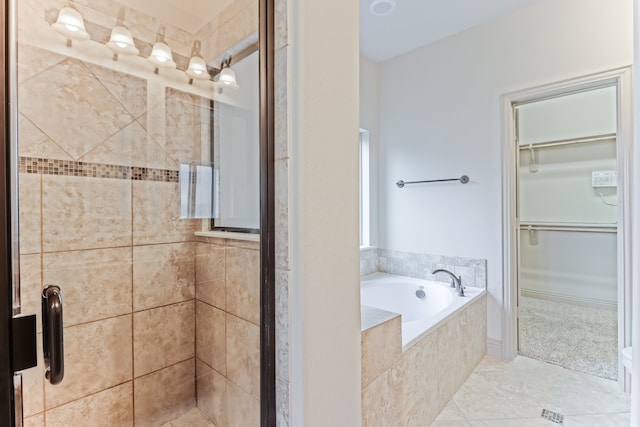 bathroom featuring separate shower and tub