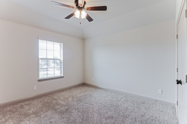 empty room featuring ceiling fan and light carpet