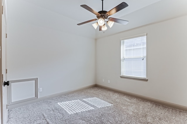 spare room with light colored carpet and ceiling fan