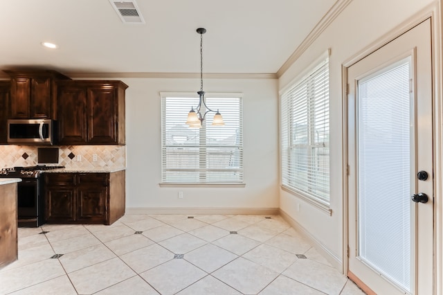 kitchen featuring an inviting chandelier, decorative backsplash, hanging light fixtures, ornamental molding, and black stove