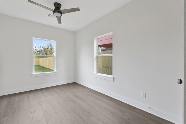 unfurnished room featuring light wood-type flooring and ceiling fan