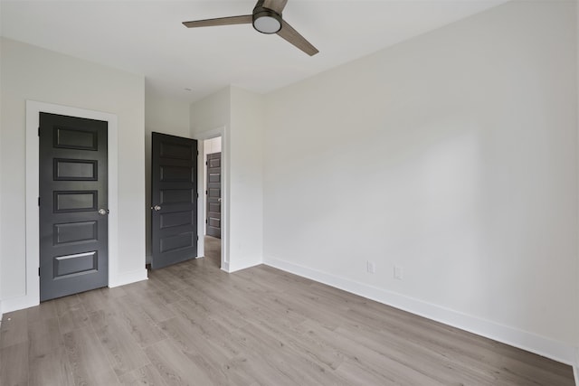 unfurnished bedroom with ceiling fan and light hardwood / wood-style flooring