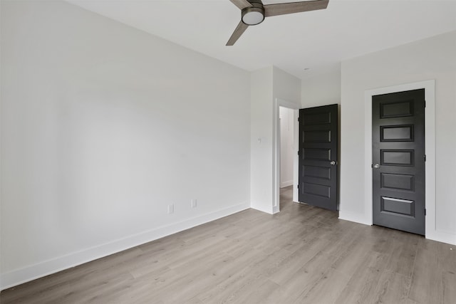 unfurnished bedroom featuring ceiling fan and light wood-type flooring