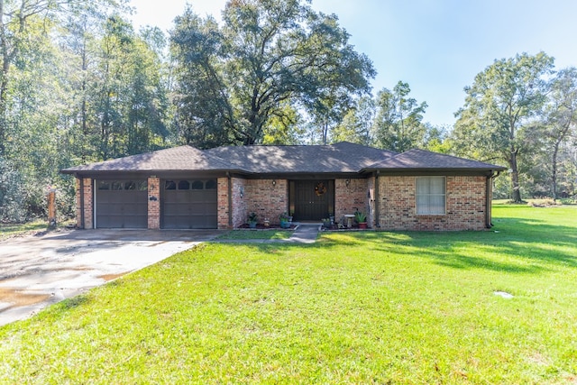 ranch-style house featuring a front lawn and a garage