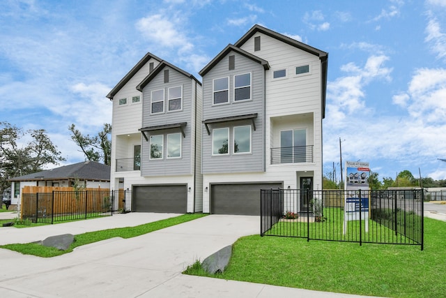 view of front facade featuring a garage and a front yard