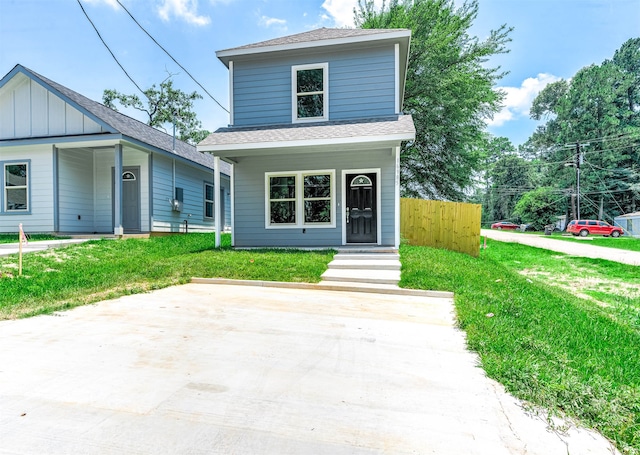 view of property featuring a front lawn