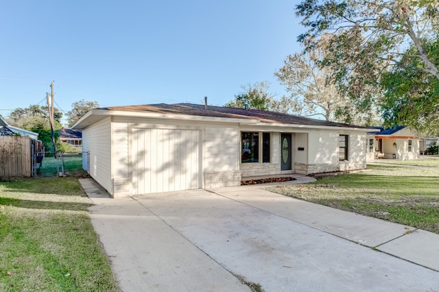 ranch-style home with a garage and a front yard