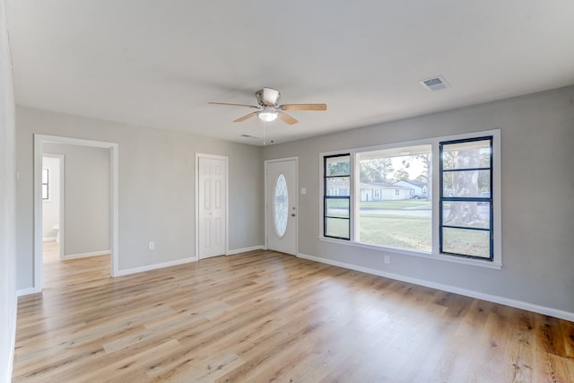 entryway with light wood-type flooring and ceiling fan