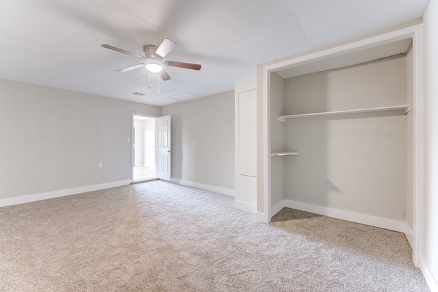 unfurnished bedroom with carpet flooring, ceiling fan, and a closet