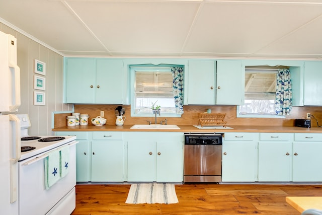 kitchen featuring white electric range oven, a sink, light countertops, light wood-type flooring, and stainless steel dishwasher