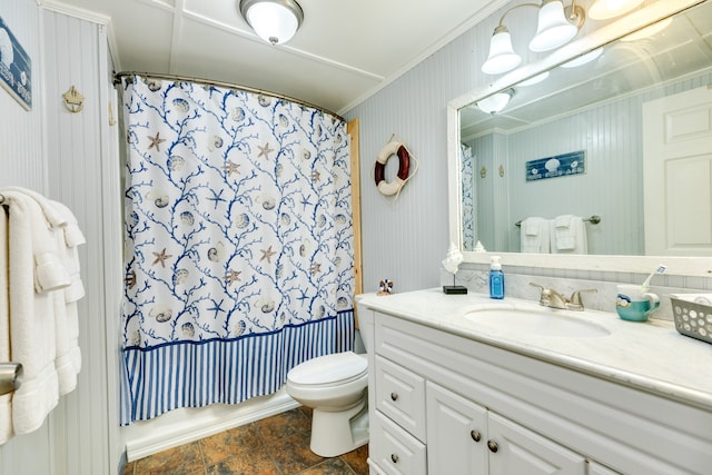 bathroom featuring toilet, shower / bath combo with shower curtain, and vanity