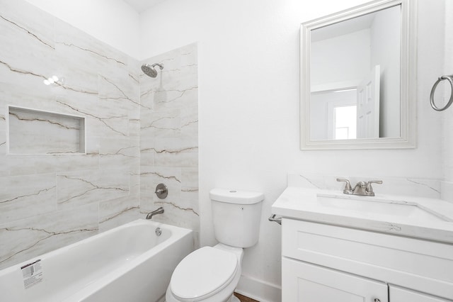 full bathroom with vanity, toilet, and tiled shower / bath