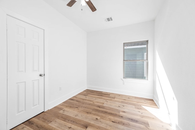 empty room with light hardwood / wood-style floors and ceiling fan