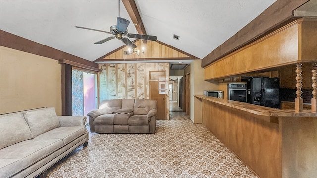 carpeted living room with lofted ceiling with beams and ceiling fan